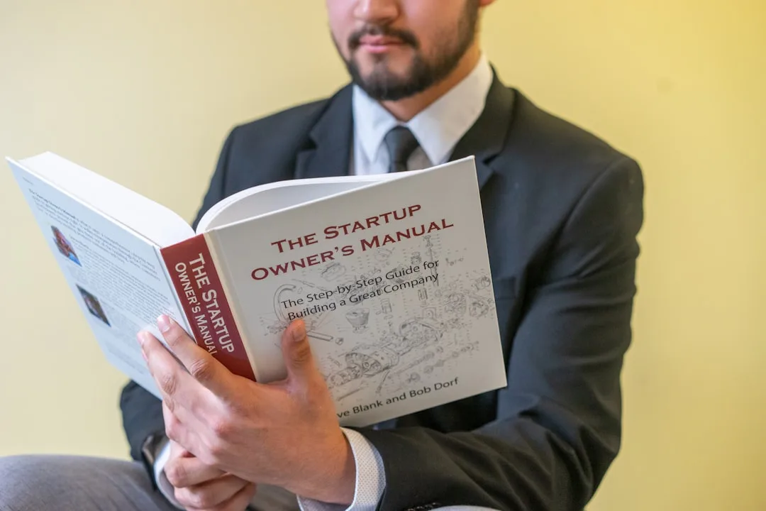 person reading real estate documents