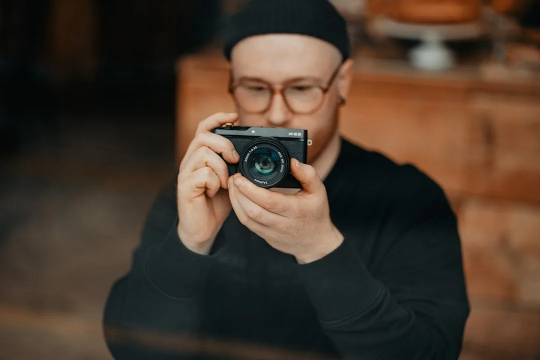 photographer adjusting camera settings